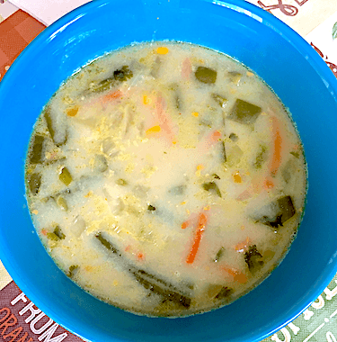 Corn chowder made with coconut milk, green beans, carrots, and spices